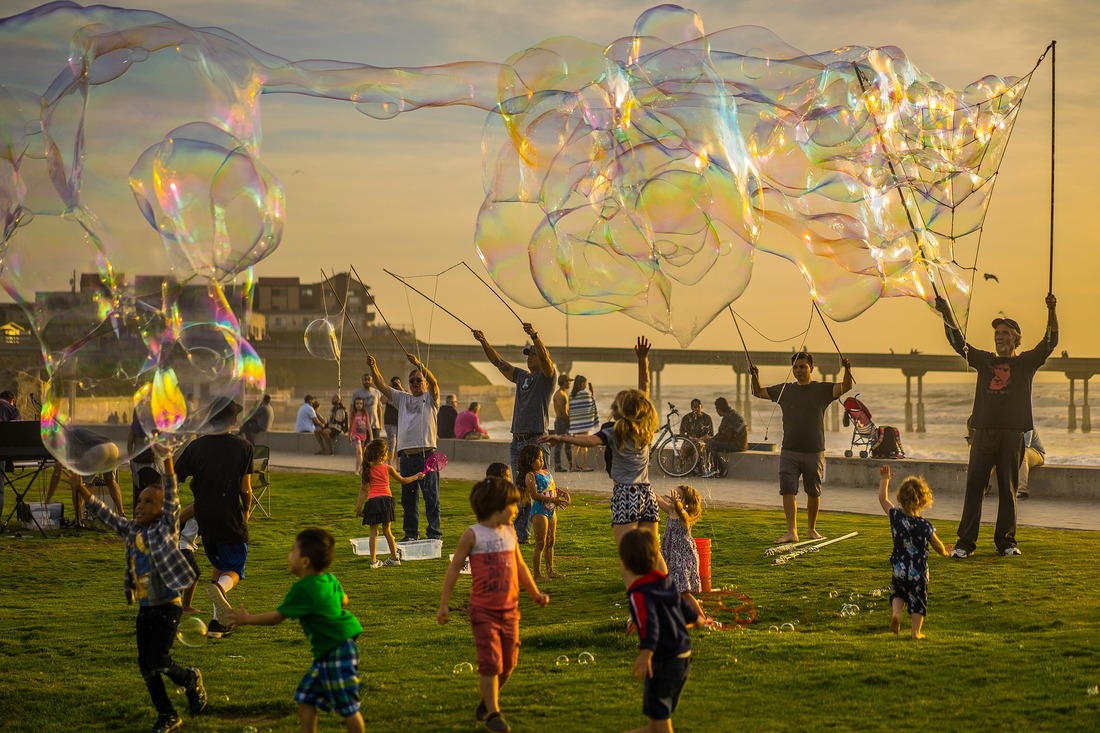 children playing with bubbles