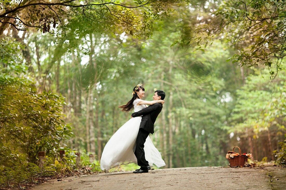 Asian wedding couple embracing 