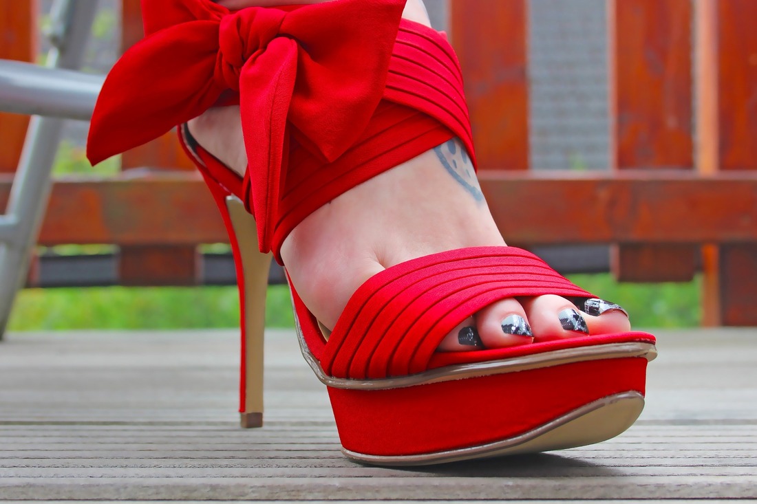 woman's foot in red high heel